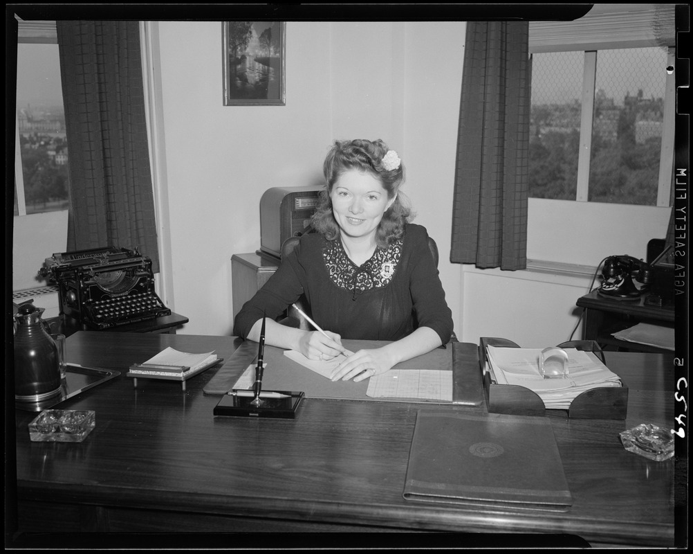 Portrait of Miss Scott at a desk