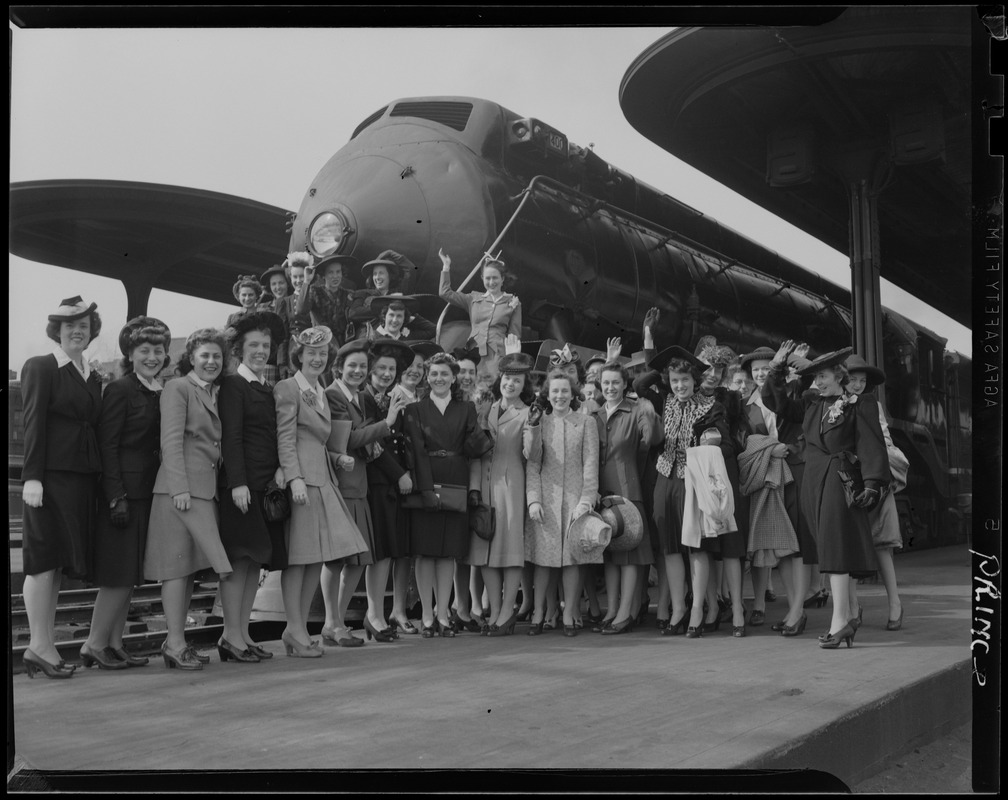 Prince women in front of a train