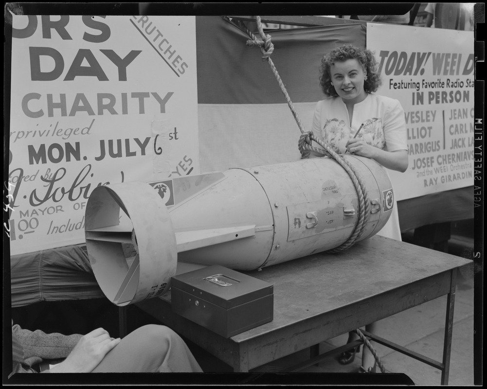 Jean Collins signs a bomb at the WEEI Day on the Common