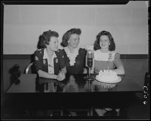 Three women and a cake