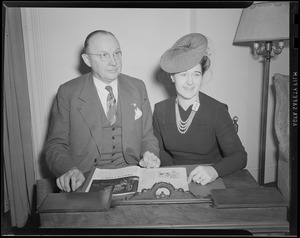 Man and woman seated at desk
