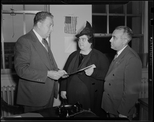 Two men and a woman holding paper