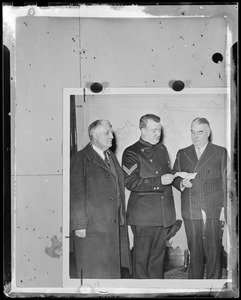 Man in uniform reading
