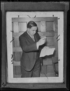 Man pointing while reading