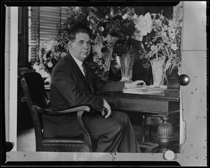 Portrait of man at desk