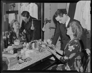 Unidentified man and woman at dressing table