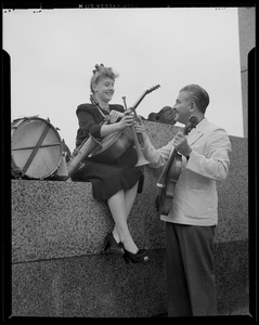 Arthur Fiedler and Harter with musical instruments