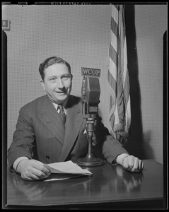 Man seated at WCOP microphone