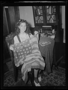 Youth on Parade girl holding up crochet American flag