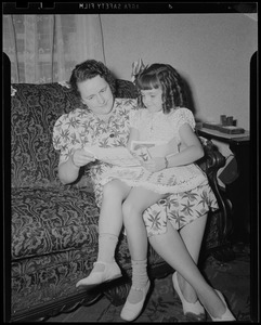 Youth on Parade girl and mother reading on couch