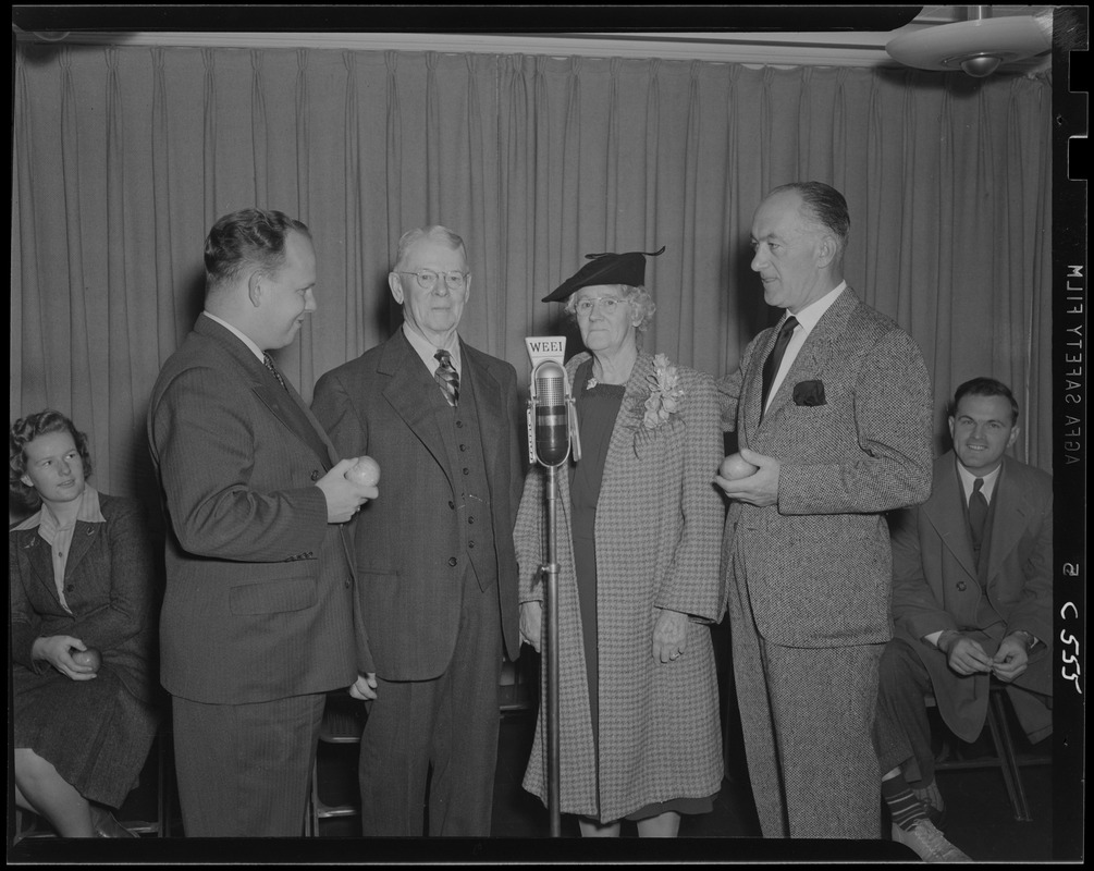 Mr. and Mrs. Moore at the microphone with Ray Girardin and Carl Moore