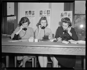 Women taking phone calls in the Boston Opera Association office