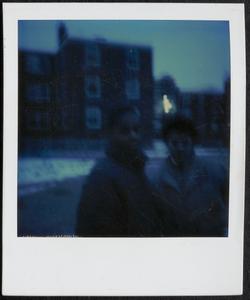 Two young people standing in Newtowne Court
