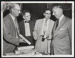 Introducing new "easy-to-use" Saran Wrap package at Manger Hotel meeting are (left to right) George Hall and Richard Gardner, both of Abbott & Hall Co.; Howard Dart, sales manager, Dow Chemical Co., and Robert Abbott, Abbott & Hall Co.