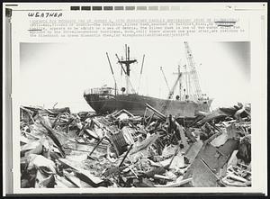 Weather. Sea Of Debris -- The freighter, Silver Hawk, beached at Gulfport, Miss., by Hurricane Camille, appears to be adrift on a sea of debris. The Silver Hawk is one of two cargo ships run aground by the 200-mile-an-hour hurricane. Both, still there almost one year after, are yielding to the blowtorch as crews dismantle them.