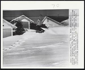 Florida Mass. - Roof Snowshoeing - Shirley Trombley, walks directly off roof of Whitcomb Summit gift house on top of the Mohawk Trail, where the snow had drifted to a height of over 12 feet.