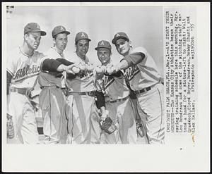 A’s Start Their Workouts--The Kansas City Athletics began their spring training schedule here this morning. Mgr. Lou Boudreau and some of the pitching staff extend a hand for a picture-left to right: Walt Craddock,Cloyd Boyer,Boudreau,Bobby Shantz and Alex Kellner.