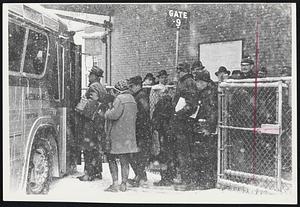 Early Rush Hour---Large crowds jammed the bus terminals as businesses and factories let workers out early. A sizeable home-bound group is shown at the Trailways Terminal in Park Square.