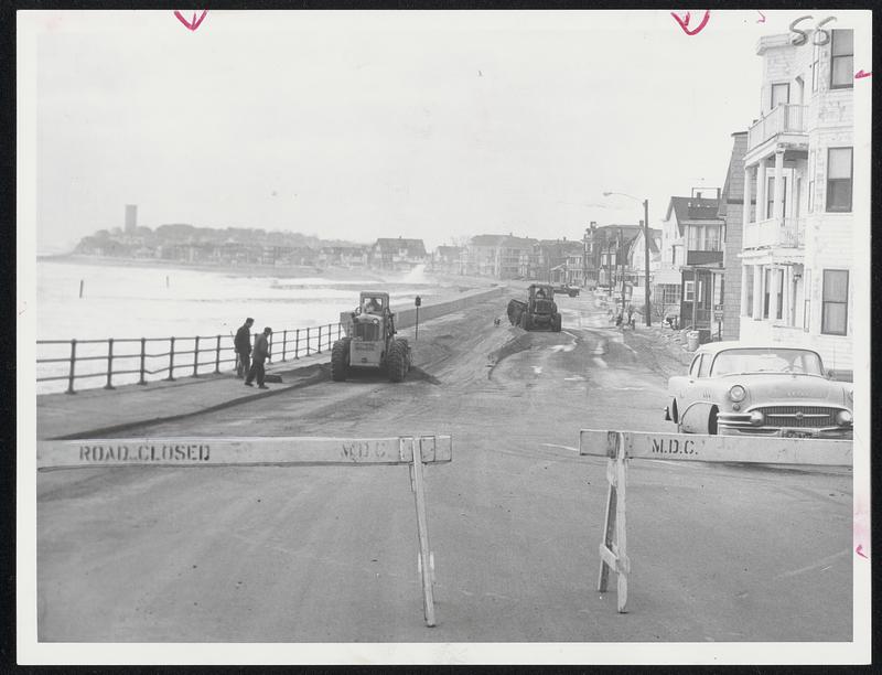 Sand and Gravel tossed up by the storm is cleared from Winthrop Shore