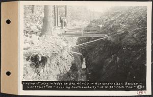 Contract No. 39, Trunk Line Sewer, Rutland, Holden, laying 12 in. pipe in ledge at Sta. 40+00, looking southeasterly, Rutland-Holden Sewer, Holden, Mass., Oct. 10, 1933