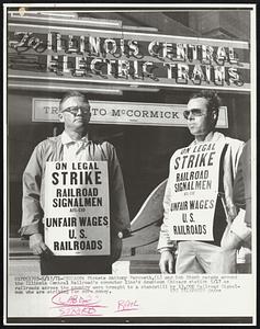 Pickets Anthony Parqueth, (l) and Bob Stech parade around the Illinois Central Railroad's commuter line's downtown Chicago station 5/17 as railroads across the country were brought to a standstill by 13,000 Railroad Signalmen who are striking for more money.