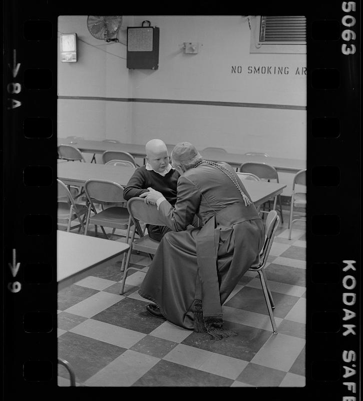 Cardinal Law and bald boy at Immaculate Conception