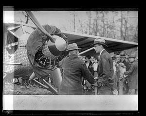 Charles Lindbergh speaking to someone in front of his plane, "Spirit of St. Louis"