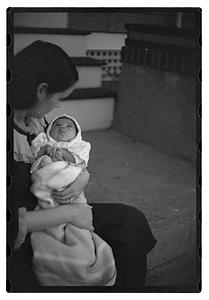 Mercedes Pasarell Sanromá holding a baby