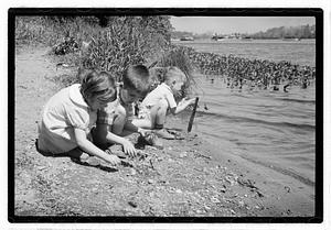 Children by a body of water