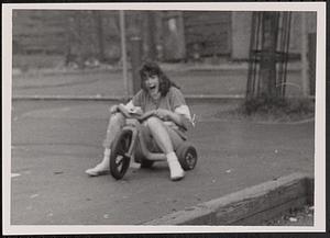 Young woman on a tricycle