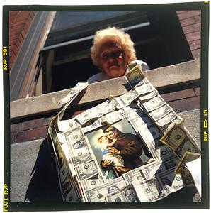 Boston: North End - A woman holds her donation for the feast of St. Anthony
