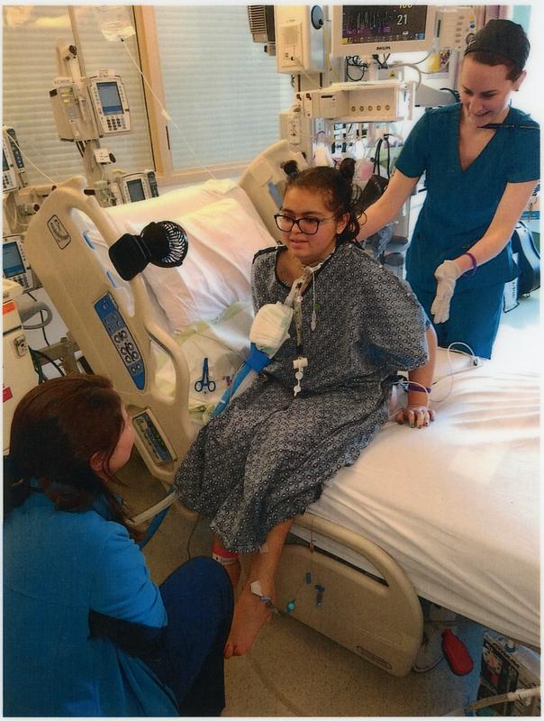Abigail Garcia being helped to do (PT) by the dynamic duo Colleen and Erin