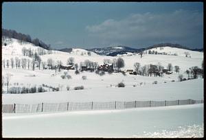 View of buildings on snow-covered hills