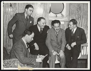 Acosta and Berry Arrive on the Paris New York City - Bert-Acosta and Major Gordon Berry, the well-known aviators, are shown in their cabin aboard the French liner with their attorney and questioning government agents, who sought information about the enlistment of Acosta and Berry in the military forces of the Spanish Loyalist Government. Left to right, in the picture are John F. Newman, Assistant U.S. Attorney in charge of the Criminal Division; Lewis Landes, Attorney for Acosta and Berry; Bert Acosta and Major Gordon Berry.