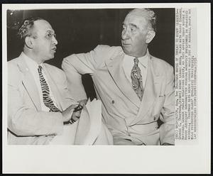 Washington, Aug. 1--Trautman Warns of Threat To Minor Leagues--George C. Trautman, (right) minor league boss, talks with Harry Simmons, National League public relations chief, as they appear today before a House Judiciary subcommittee probing monopoly influences in organized baseball. Trautman said minor leagues would die if baseball drops the rule protecting clubs' exclusive territories.