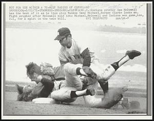 Not For Use Within a 75-Mile Radius of Cleveland. Indians pitcher Sam McDowell has the best of it as he lies atop Yankee Gene Michael. Horace Clarke looks on. Fight erupted after McDowell slid into Michael. McDowell and Indians won game, too, 2-1, for a split in the twin bill.