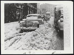 Syracuse, N.Y. -- Tough Going -- A 24-hour, eight-inch snowfall degenerated into this slush today putting both city crews and drivers to the test. Heavy wet snow began to fall again during the day to add to the mess.
