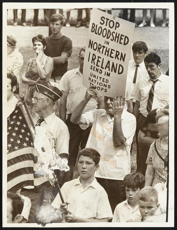 Worcester Delegation, carrying flag and poster, participate in rally on Boston Common.