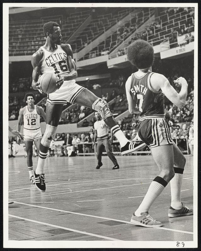 In Right Spot -- Veteran Celts' forward Tom Sanders (16) picks off rebound as Cleveland's Bob Smith (7) is out of position for carom.