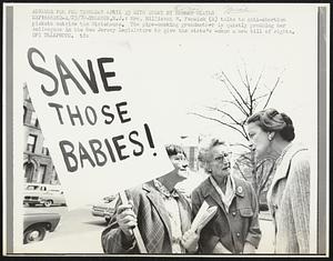 Trenton, N.J.: Mrs. Millicent H. Fenwick (R) talks to anti-abortion pickets outside the Statehouse. The pipe-smoking grandmother is quietly prodding her colleagues in the New Jersey Legislature to give the state's women a new bill of rights. Demos. Misc.