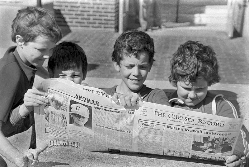 Kids reading the Record