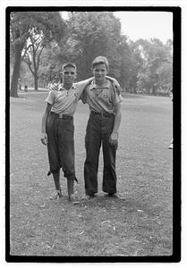 Two boys, both wearing medals