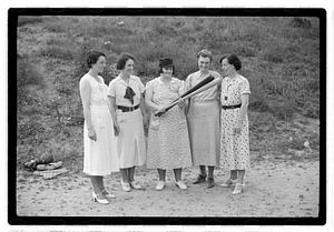 Five women, one holding two baseball bats