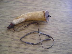 Powder horn with leather strap