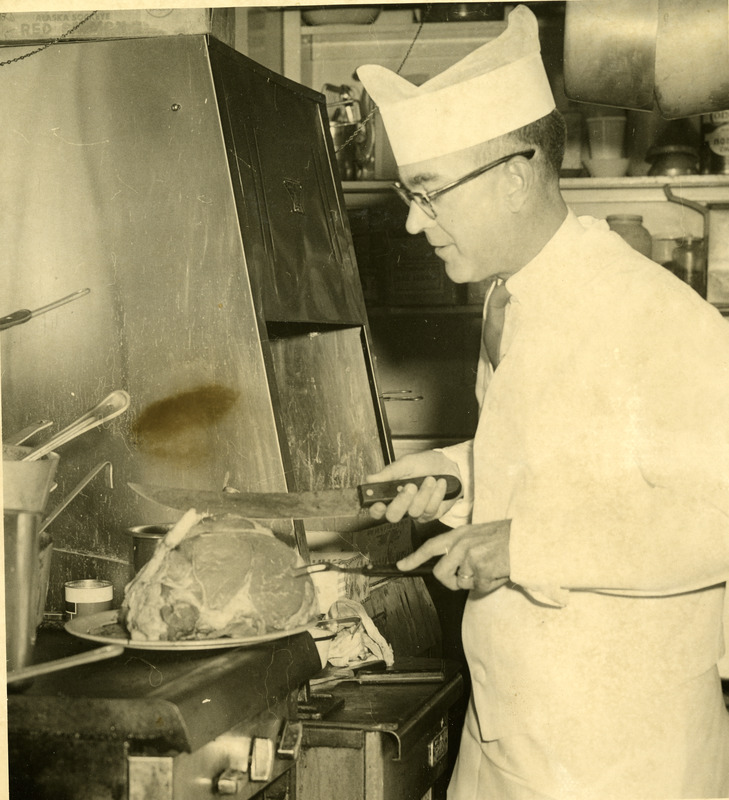 Dr. Ralph C. Monroe cooking during businessmen's day in Southbridge Massachusetts