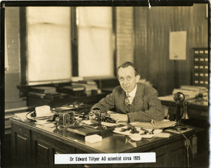 Portrait of Dr. Edgar D. Tillyer, at his desk, at the American Optical Company Southbridge