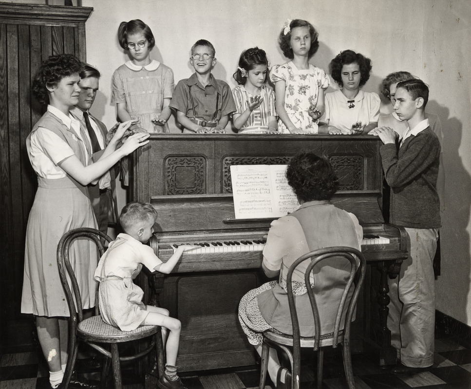 Students Surrounding Piano