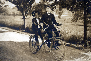 Thomas and Joseph on a Sociable Tricycle