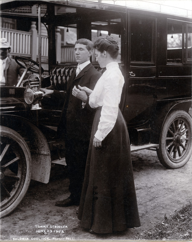 Tommy Next to an Automobile