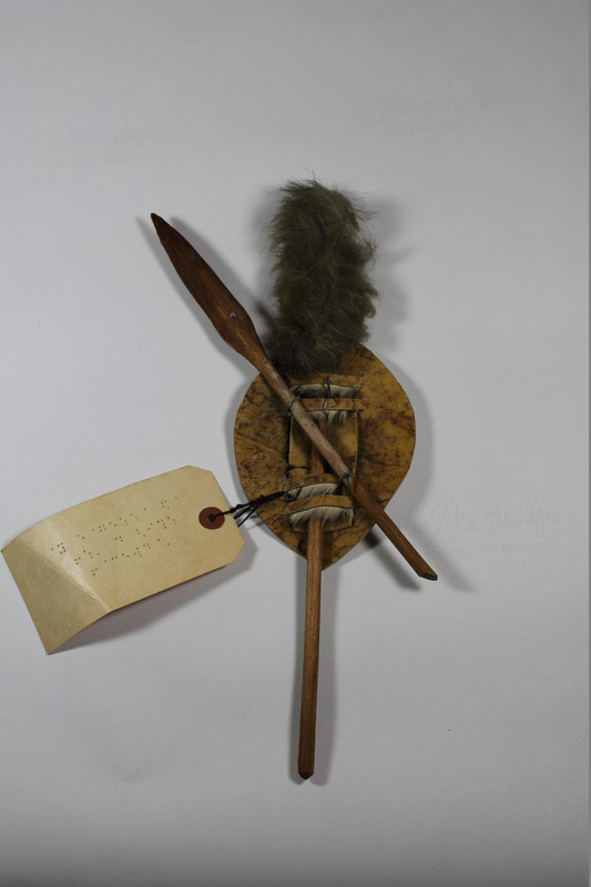 Back view of miniature shield and sword from South Africa